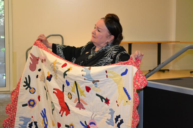 Patricia Polacco with quilt