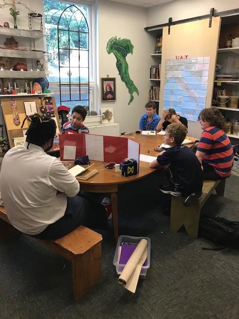 students and teacher playing dungeons and dragons