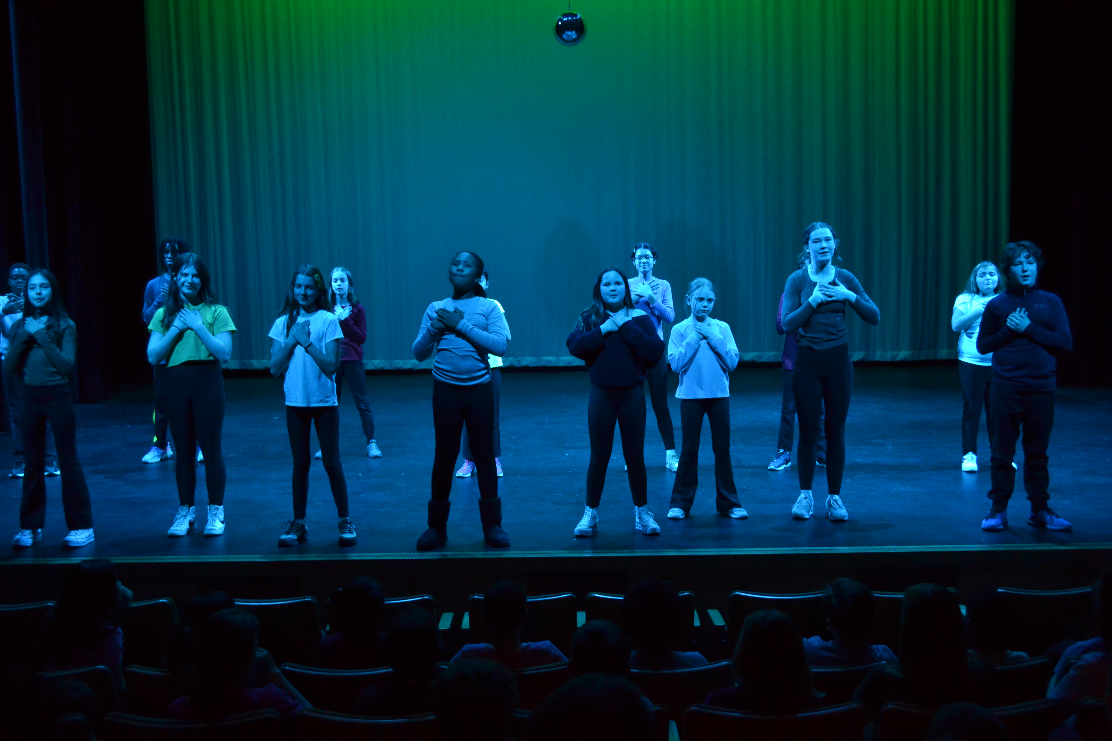 students on theater stage