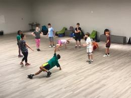 studnets in movement studio stretching