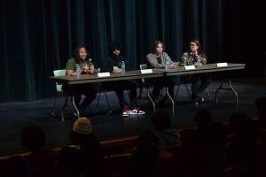 panel of alumni on stage