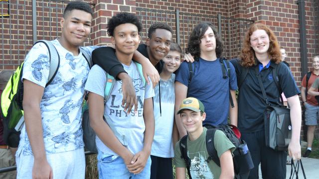 Group of high school kids standing together outside